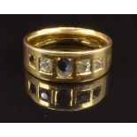 An 18ct gold ring set with three diamonds, size M, 6.4g