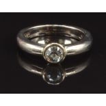 An 18ct gold ring set with a round cut diamond of approximately 0.3ct, size H, 4.8g