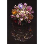 A yellow metal ring set with sapphires, rubies, garnets, amethyst, topaz and citrine, size Q, 6.1g