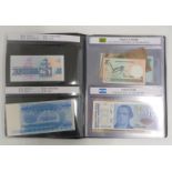 World Paper Money albums containing approximately 35 uncirculated banknotes with labelled ages