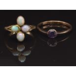A 9ct gold ring set with an amethyst, size M and a 9ct gold ring set with opals, size G, 3.3g