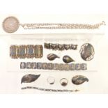 A silver pendant set with a 1899 silver dollar and a quantity of Siam silver jewellery including