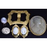 A yellow metal buckle with chased decoration, a c1900 lava cameo brooch, Victorian brooch and two