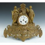 19thC figural mantel clock with Roman enamel dial, Breguet style hands, and two train movement