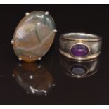 A silver ring set with an agate cabochon and a silver ring set with an amethyst