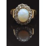 Victorian ring set with an oval opal cabochon surrounded by rose cut diamonds, size K, 4g
