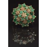 A 9ct gold ring set with round cut emeralds and diamonds in a large cluster, size O, 4.7g