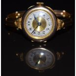 Unnamed 9ct gold ladies wristwatch with blued hands, black Arabic numerals, silver and gold dial and