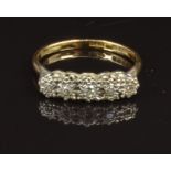 An 18ct gold ring set with five diamonds in a platinum setting, size O, 3g