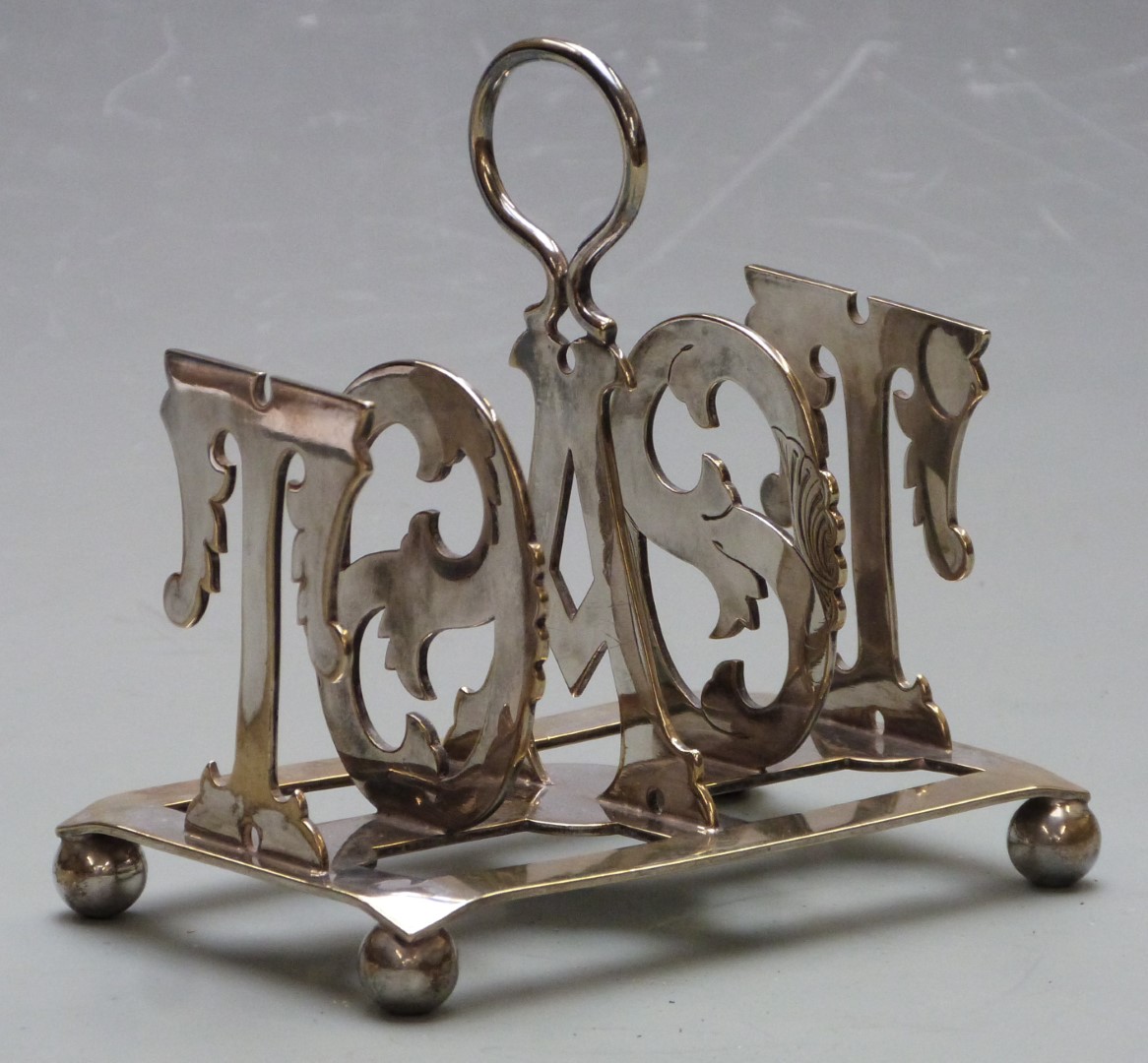 Silver plated toast rack with the bars formed as the word toast, length 12cm - Image 2 of 5