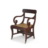 An Anglo-Indian mahogany and caned metamorphic library armchair, late 19th/early 20th century