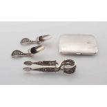 A pair of German silver tea caddy spoons and a pair of sugar tongs, .800 standard, late 19th/early 2