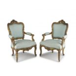A pair of Louis XV style giltwood and upholstered armchairs, 19th century