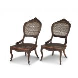 A pair of fruitwood and caned salon chairs