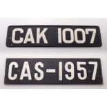 A black and white painted steel vehicle registration number plate CAK 1007