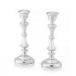 A pair of Elizabeth II silver candlesticks, W I Broadway & Co, Birmingham, 1957