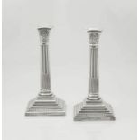 A pair of electroplated Corinthian silver candlesticks, 20th century