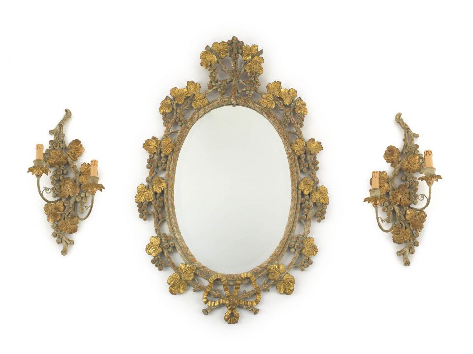 An Italian painted and gilt mirror and a pair of two-light wall sconces, en suite, 20th century