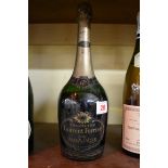 A bottle of Laurent Perrier cuvee grand siecle 1953 vintage champagne.