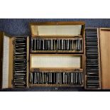 GLASS SLIDES: a quantity in 4 old wooden cases.