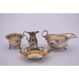 A silver sauce boat, by Horace Woodward & Co Ltd , London 1916; together with a silver creamer and