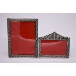 Two Thai white metal photograph frames, aperture of largest 15 x 20cm. (2)