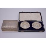 A cased pair of silver ashtrays, by Walker & Hall, Birmingham 1934, 58g; together with a silver