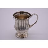 A silver baluster Christening mug, by Mappin & Webb, London 1997, 9cm high, 185g.