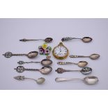 A small selection of silver and other souvenir teaspoons; together with a pocket watch etc.