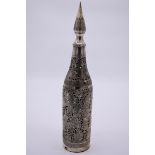 An Islamic pierced white metal bottle cover and stopper, 41cm high.