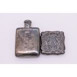 A small silver hip flask, retailed by Finnigan's, London 1912, 8cm high; together with a small