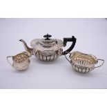 A Victorian silver three piece bachelor's teaset, by William Aitken, Chester 1900, 433g all in.