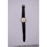 A vintage Accurist 'Shockmaster' 9ct gold manual wind wristwatch, 33mm, on original black leather