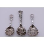 A William IV silver shell, fiddle & thread pattern caddy spoon, makers mark indistinct, London 1834;