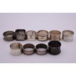 Nine various silver napkin rings, 148g; together with an unmarked example. (10)