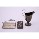 A small group of silver and other items, comprising; a George III milk jug, by R H, London 1784; a