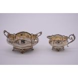 An Edwardian silver sugar bowl and matching cream jug, by Charles Wilkes, Birmingham 1907, 14.5cm