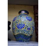 A Continental pottery vase, decorated with stylized flowers, 31cm high, (drilled).