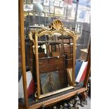 (HP) A reproduction gilt framed wall mirror, with shell crest, 111 x 77cm.