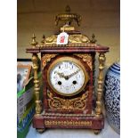 A late 19th century red marble and gilt metal mantel clock, the enamel dial inscribed 'Tree, 121