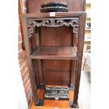 (HP) A Chinese hardwood two tier jardiniere stand, with pierced frieze, 41cm wide.