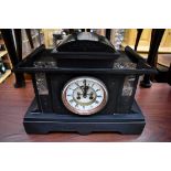 A late Victorian slate and marble mantel clock, 39.5cm wide, with pendulum.