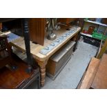 An old pine kitchen table, on turned legs, 153cm long.