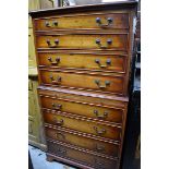 (HP) A reproduction yew wood and crossbanded chest on chest, labelled 'Bradley', 75cm wide.