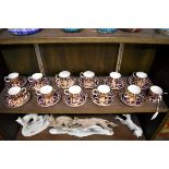 Twelve Royal Crown Derby Imari coffee cans and eleven saucers, three cans of varying design.