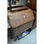 A George III oak bureau, on cabriole legs, 76cm wide.