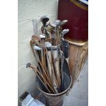 A large quantity of vintage golf clubs.