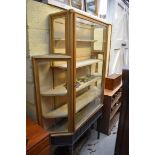 An early 20th century mahogany and gilt shallow display cabinet, 121cm wide.