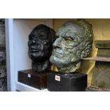 Two bronzed pottery heads, one depicting John Kennedy, each on plinth, lifesize. (2)