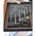 A framed display of seven antique steel keys, largest 16.5cm long.